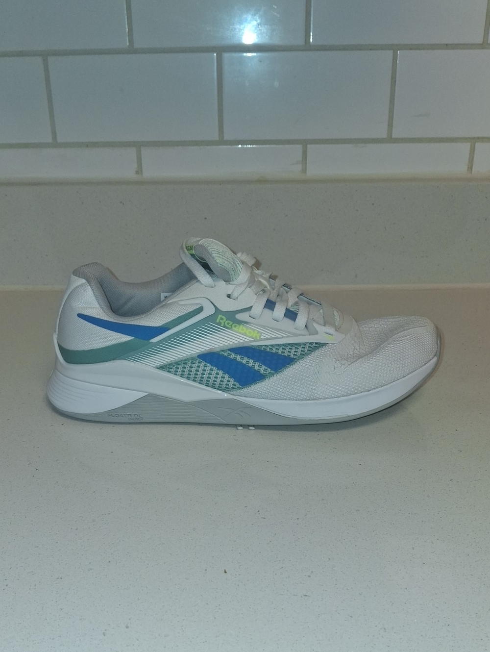 Reebok Men’s White Athletic Shoe with Blue & Teal Accents